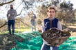 © JackF - Woman showing harvest of olives