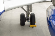 Chocks Securing A Plane Undercarriage.