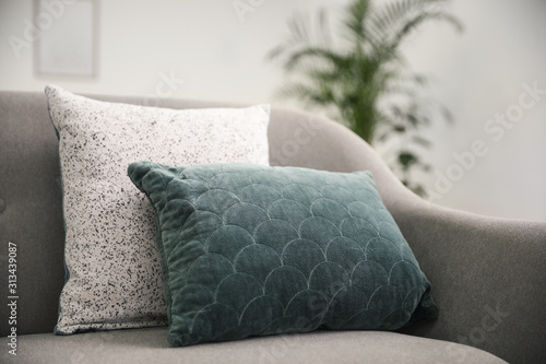 Fotomural Soft pillows on grey sofa in living room