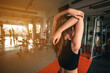 © Take Production - fitness ,workout, gym exercise ,lifestyle  and healthy concept. Women warm up before exercising at the indoor gym at sunset.