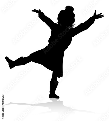 A child in silhouette playi...