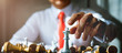 © whyframeshot - business strategy brainstorm chess board game with hand touch black background with free copy space for your text