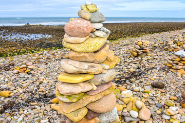 towers made of stones on the beach