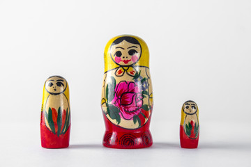 Three Russian dolls on a white background.