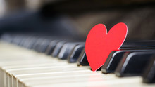 Small Red Paper Heart On Piano Keys