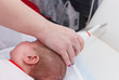 Ultrasound examination of the head. Examination of a month old baby