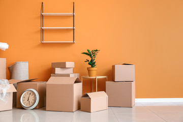 Canvas Print - Cardboard boxes with belongings in new flat on moving day