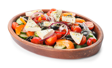 Plate of tasty Greek salad on white background