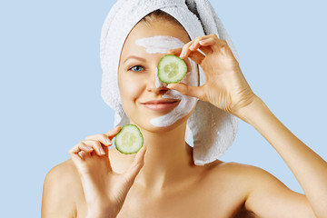 Wall Mural - cosmetology, skin care, face treatment, spa and natural beauty concept. woman with facial mask on he