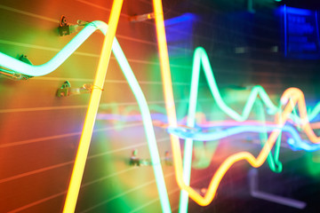 Abstract neon tube light symbol of financial chart