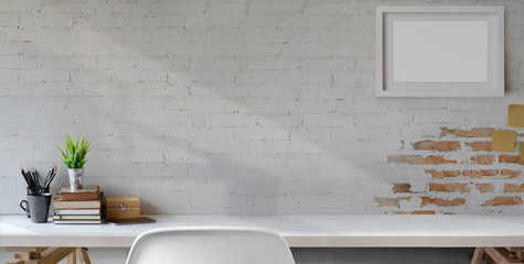 Wall Mural - Top view of comfortable vintage workplace with office supplies and copy space on white table and brick wall