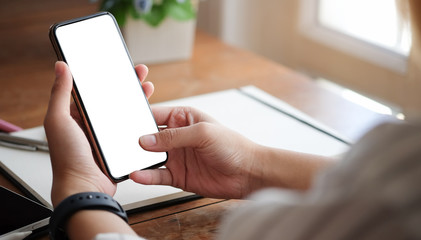 Wall Mural - cropped shot view of woman hands holding smart phone with blank copy space screen for your text mess