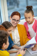 © zinkevych - Children learning English grammar with their teacher