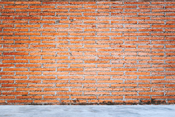 Canvas Print - Outdoor concrete floor texture with red bricks wall background.