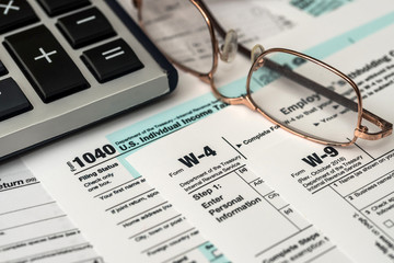 Paper blanks of 1040, w4 and w9 tax form close up