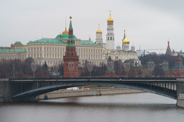 Moscow downtown cityscape. Kremlin Towers, the Residence of the President of Russian Federation, Ivan the Great Bell Tower, Dormition Cathedral, Bolshoy Kamenny Bridge in overcast winter day