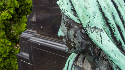 Statue of a woman's face in the St. John's cemetery in Nuremberg