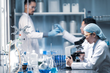 Wall Mural - health care researchers working in life science laboratory