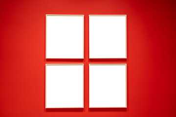 Four white square mockup on a red wall