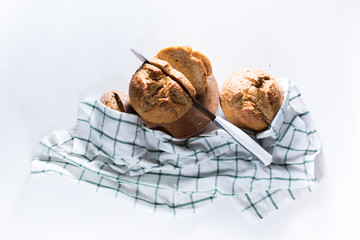 Whole grain bread with seeds cutting with knife