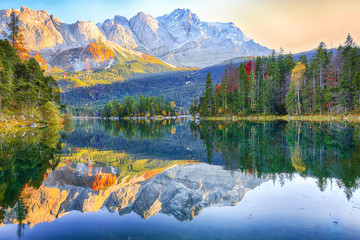 Wall Mural - faboulus autumn landscape of eibsee lake in front of zugspitze summit under sunlight