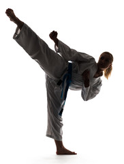 Wall Mural - Karate woman posing standing on one leg