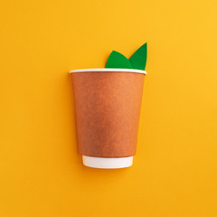 Cardboard coffee Cup, symbol of recyclable paper resources, reused raw materials