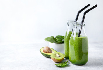 Poster - green smoothie in glass bottles