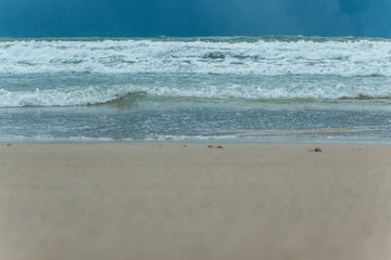 Sea Beach and Soft wave of blue ocean. beautiful summer background with sandy beach