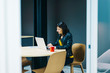 © Cavan Images - Entrepreneur working with a laptop at office
