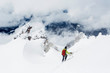 © Cavan Images - A young man descends from the summit of Mt. Hood on a cloudy day.