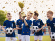 © matimix - Happy kids in elementary school sports team celebrating soccer succes in tournament final game