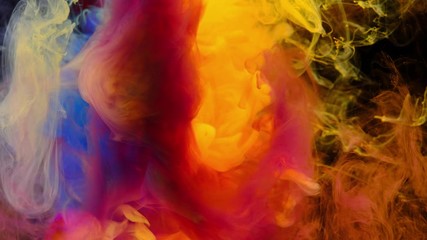 Wall Mural - Color paint drops in water , abstract color mix , drop of Ink color mix paint falling on water Colorful ink in water, 4K footage,