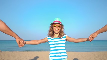 Poster - Happy family having fun on summer vacation. Slow motion