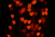 Valentines Background. Abstract Heart Bokeh Background. Defocused Blurred Heart Shaped Lights. St. Valentines Day Background