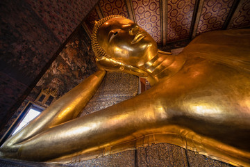 famous golden reclining buddha statue at wat pho bangkok thailand