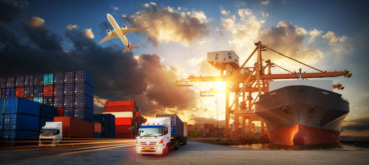 Wall Mural - Container truck in ship port for business Logistics and transportation of Container Cargo ship and Cargo plane with working crane bridge in shipyard at sunrise, logistic import export and transport 