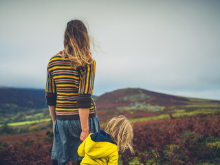 young mother and toddler walking on the moor in autumn