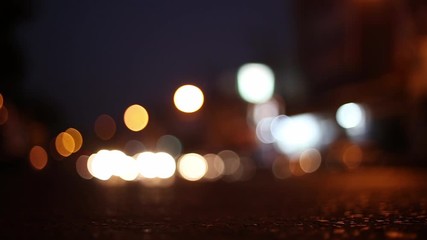 Wall Mural - Blurred bokeh traffic on the road at night in a big city.