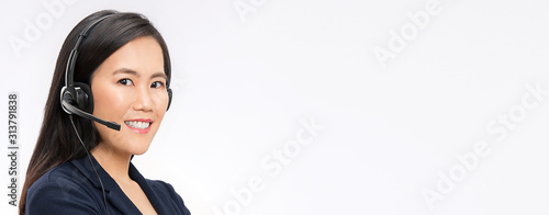 Cuadros en Lienzo Portrait of asian woman customer support phone operator in headset with copyspace isolated on white background