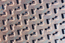A Metal Manhole Cover On Spanish Urbanisation