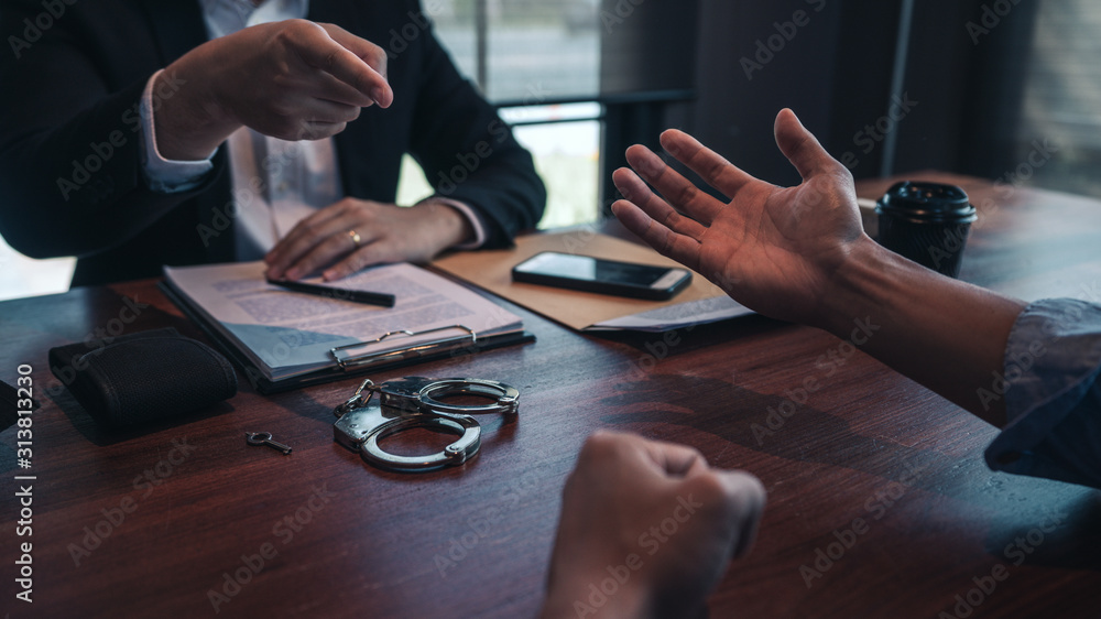 police officer presenting evidence to suspect after committed a crime ...
