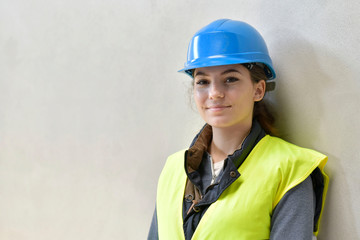 Wall Mural - Young apprentice with security helmet, isolated on background