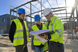 © goodluz - Engineering instructor working on building site with apprentice