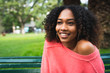 © Mego-studio - Afro-american woman sitting in the park.
