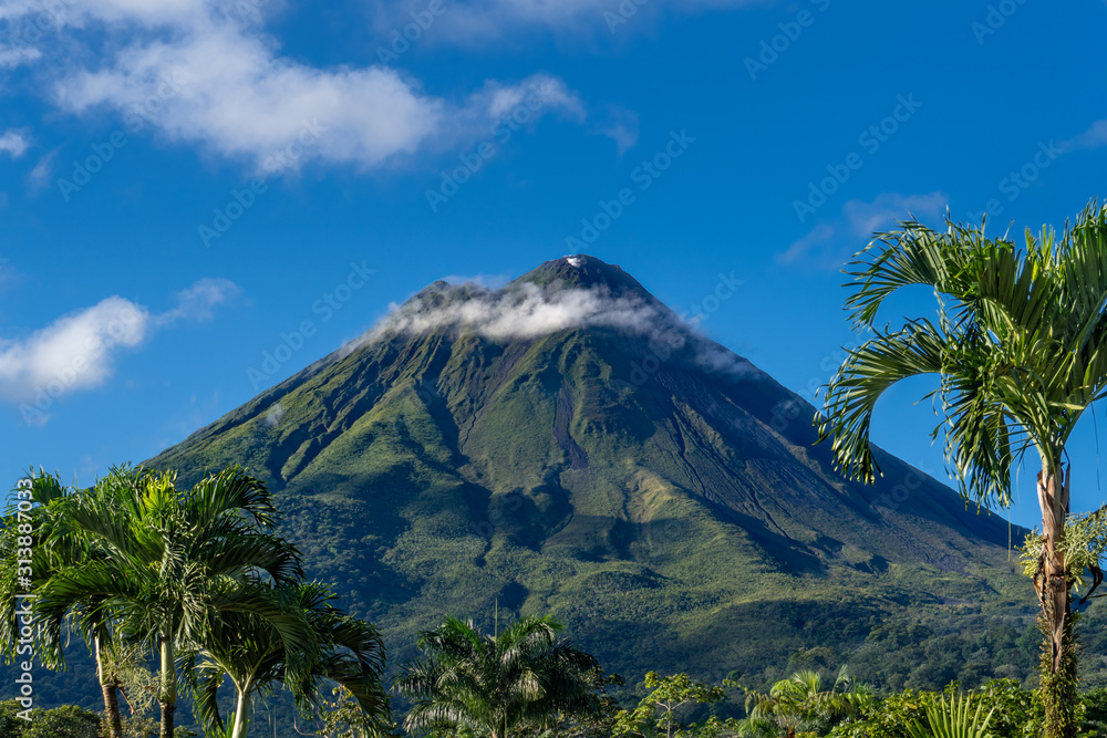 Costa Rica. The Arenal Volcano (Spanish: Volcan Arenal) in north-western Costa Rica in the province of Alajuela. It is an active andesitic stratovolcano. - obrazy, fototapety, plakaty 