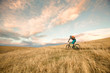 © Tandem Stock - One woman enjoys the first rideable window over Jones Pass on the Continental Divide Trail in Colorado. As the snow melts off the high alpine trails, rocky singletrack is revealed on the Rocky Mountains for a short window before winter hides them under her blanket again.