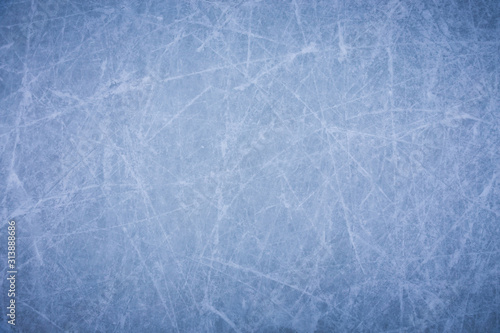 Ice background with marks from skating and hockey, blue texture of rink surface Wallpaper Mural