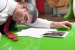 © moodboard - Businessman asleep on documents