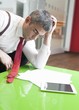 © moodboard - Businessman falling asleep whilst reading documents